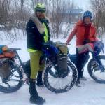 Forest Wagner, left, and Ned Rozell reach the village of Kaltag on the Yukon River on April 7, 2026. They are attempting to pedal fat bikes from Fairbanks to Nome. Photo courtesy Chris Carlson
