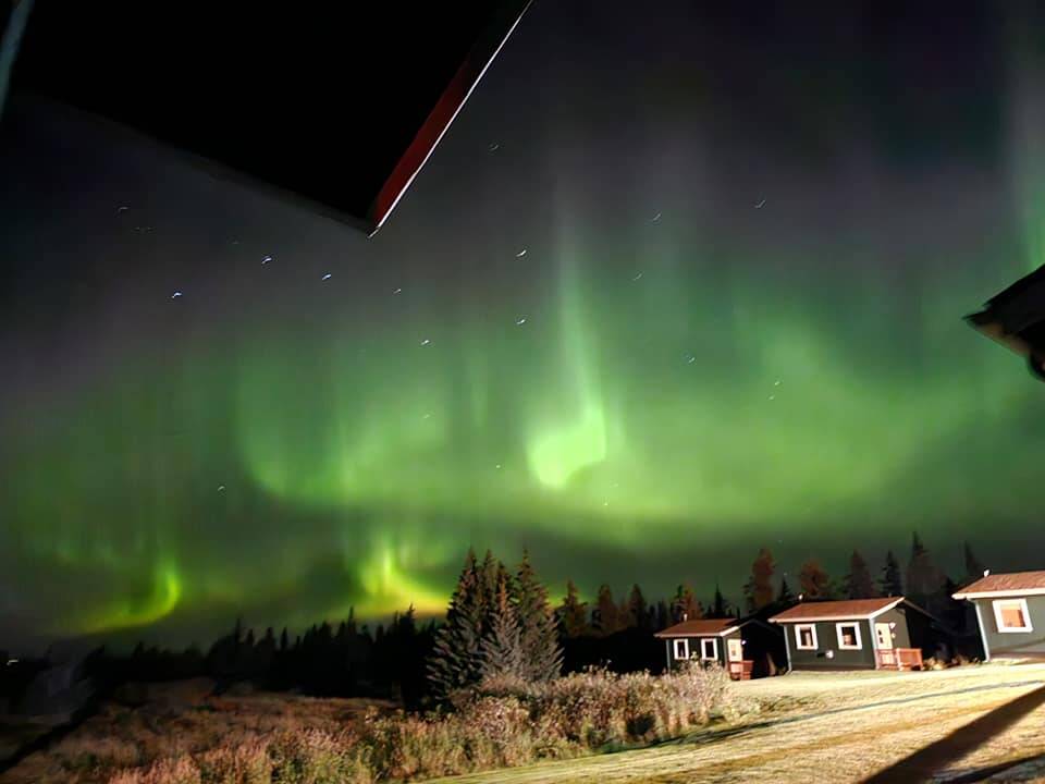 Storyknife Writers Retreat cabin under the Northern Lights in September 2023.