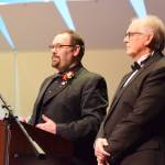 Homer High School choir director Kyle Schneider (left) and retired choir director Mark Robinson (right) give a pre-concert lecture on the Mozart Requiem on Friday, May 1, 2026, in the Homer High School Mariner Theatre in Homer, Alaska. (Delcenia Cosman/Homer News)