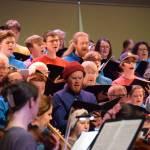 Members of the Homer High School Concert Choir and Kenai Peninsula Community Choir rehearse the Mozart Requiem on Thursday, April 30, 2026, on the Homer High School Mariner Theatre stage in Homer, Alaska. (Delcenia Cosman/Homer News)