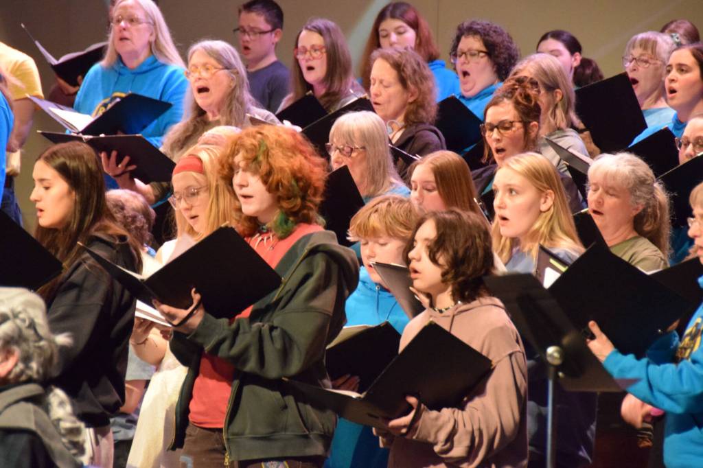 Members of the Homer High School Concert Choir and Kenai Peninsula Community Choir rehearse the Mozart Requiem on Thursday, April 30, 2026, on the Homer High School Mariner Theatre stage in Homer, Alaska. (Delcenia Cosman/Homer News)