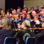 Members of the community orchestra rehearse the Mozart Requiem alongside the vocal ensemble on Thursday, April 30, 2026, on the Homer High School Mariner Theatre stage in Homer, Alaska. (Delcenia Cosman/Homer News)