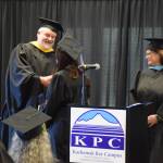 Graduates who earned their high school equivalency diplomas shake hands with Kachemak Bay Campus director Brian Partridge (left) during a commencement ceremony held Wednesday, May 6<ins>, 2026,</ins> at Kachemak Bay Campus<ins> in Homer, Alaska</ins>. (Delcenia Cosman/Homer News)