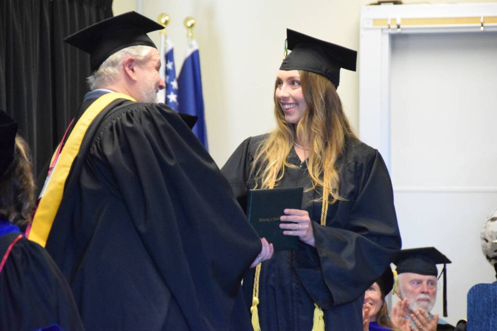 Delcenia Cosman / Homer News
University of Alaska Anchorage graduate Celeste Fairbanks shakes the hand of Kachemak Bay Campus director Brian Partridge during a commencement ceremony held Wednesday, May 6, at Kachemak Bay Campus.