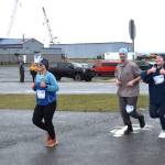 (from left to right) Whitney Carver, Gideon Plate and Kristi Stoll compete in the annual Migration Run on Sunday, May 10<ins>, 2026,</ins> on the Homer Spit Trail<ins> in Homer, Alaska</ins>. (Delcenia Cosman/Homer News)