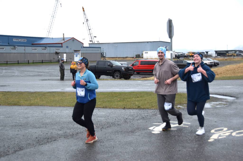(from left to right) Whitney Carver, Gideon Plate and Kristi Stoll compete in the annual Migration Run on Sunday, May 10<ins>, 2026,</ins> on the Homer Spit Trail<ins> in Homer, Alaska</ins>. (Delcenia Cosman/Homer News)