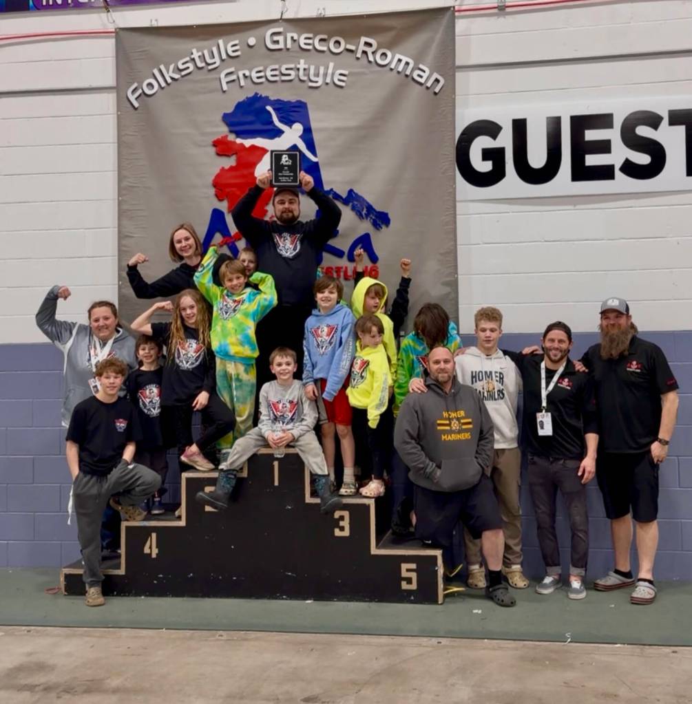 PHOTOS BY Whitney Bogatko
Members of the Anchor Kings Wrestling Club pose on the podium after winning state championship titles earlier this year.