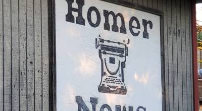 The old Homer News sign hangs on the side of the papers former office in 2024. (Delcenia Cosman/Homer News)