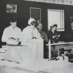 Louisa Miller photo from Once upon the Kenai
Father Thompson (far left) leads a June 1955 Catholic mass in the Western Corral Bar in Kenai.