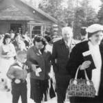 Central Kenai Peninsula Catholic faithful leave Kenais first Catholic church, a log structure, circa 1955. (Louisa Miller photo from Once upon the Kenai)