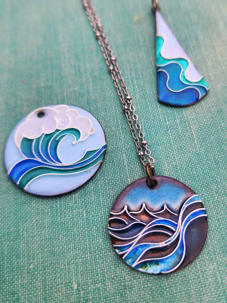 Enambled pendants by Counsel Langley, one of several newer artist members at Ptarmigan Arts Coop Gallery (Photo provided by Ptarmigan Arts)