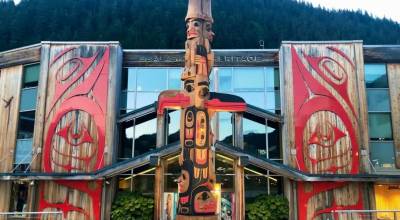 TJ Youngs 360-degree totem pole in front of Sealaska Heritage Institute in Juneau, Alaska. (Courtesy of the Sealaska Heritage Institute/photo by Brendan Sainsbury)