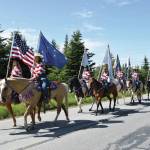 The Alaska Stars Drill Team rides down Milo Fritz Avenue during the Fourth of July parade in Anchor Point. (Delcenia Cosman/Homer News file photo)