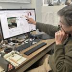 UAF professor of entomology Derek Sikes, curator of insects at the University of Alaska Museum of the North, points out birch shield bug information on the iNaturalist website. (Photo by Rod Boyce)