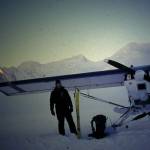 Keith Echelmeyer stands by his plane on Black Rapids Glacier in 2001. (Photo by Martin Stuefer)