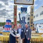Derotha Ferraro (SPH director of public relations and marketing), Kenai Peninsula Borough Mayor Peter Micciche, and Ryan Smith (SPH CEO) gather on July 2 for an employee event before the community celebration on July 3. (South Peninsula Hospital)