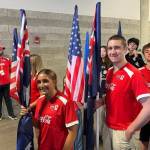 High school student and McDonalds crew member Ethan Fraker from Homer was selected as an official FIFA flag bearer for the United States second group stage match against Australia, carrying the Socceroos flag onto the pitch in front of a sold-out crowd of 66,925 fans at Seattle Stadium (Lumen Field) in Washington on June 19. (Ethan Fraker)