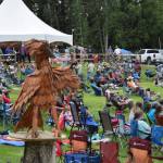 A wooden bird sculpture looks on and over attendees during Salmonfest 2025 on Aug. 2 at the Kenai Peninsula Fairgrounds in Ninilchik. (Chloe Pleznac/Homer News file photo)