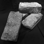 These four Russian bricks were made in the Kenai brickmaking factory that operated between 1841 and 1866. Today, they are part of the collection of historical items in the Kenai Visitors & Cultural Center. (Photo by Clark Fair)
