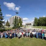 Geophysical Institute faculty, staff and student researchers gather in 2025 for a group photo with the institutes antenna-topped home building in the background. (Photo by Bryan Whitten)