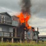 Flames shoot out of the second floor above Boardwalk Fish & Chips. (Tim Hatfield photo)